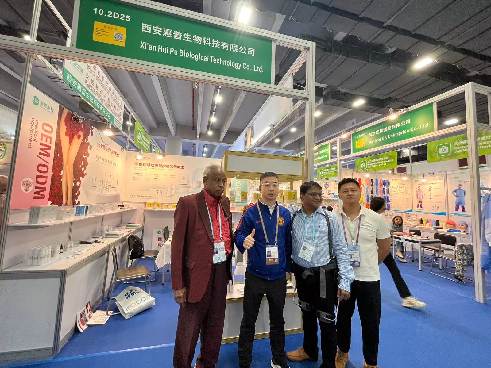 HP Biotech booth with international partners at a global trade show