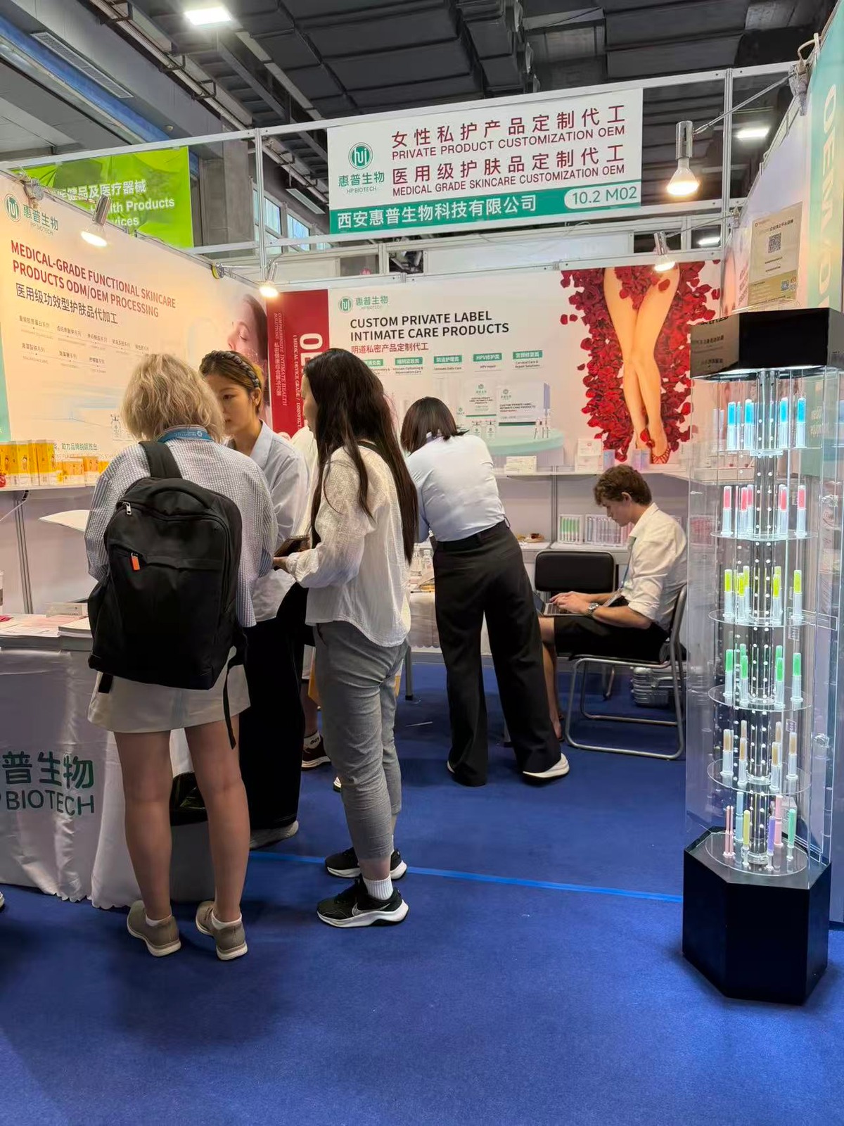 International visitors exploring HP Biotech OEM products at the booth